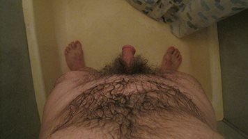 Trace your finger down my hairy front and grab a hold of my cock.