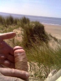 Daddies playing with my cock at the nude beach