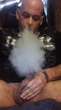 Blowing smoke on my cock