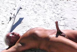 Paul Chenevey erect on a public beach