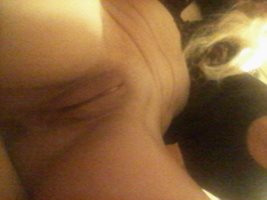 Mistress  Julie  exposes  her  shaved  pussy