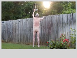 Refilling the bird feeder.. Hot weather means lots of naked times outside, ...