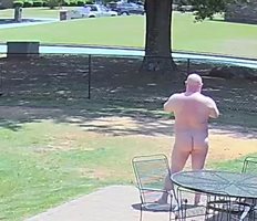 In my backyard totally nude. The picture was taken from my security camera.