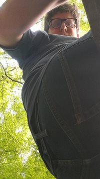 A view of my ass from beneath a bench within some woods