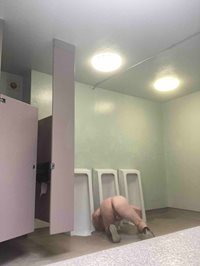 faggot cleaning public urinal.