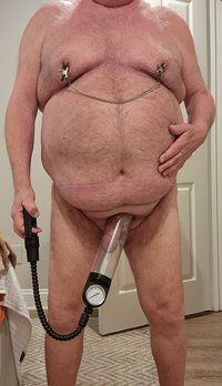 Pumping my cock and nipple clamps.
