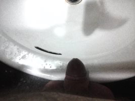 having a piss in the sink