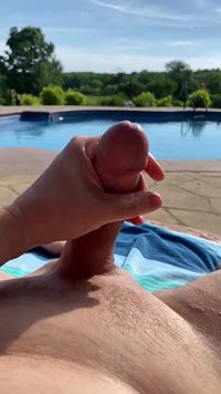 Masturbating and cumming at the pool