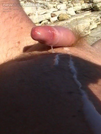 Wanked off naked and shot my load in the sun on beach.